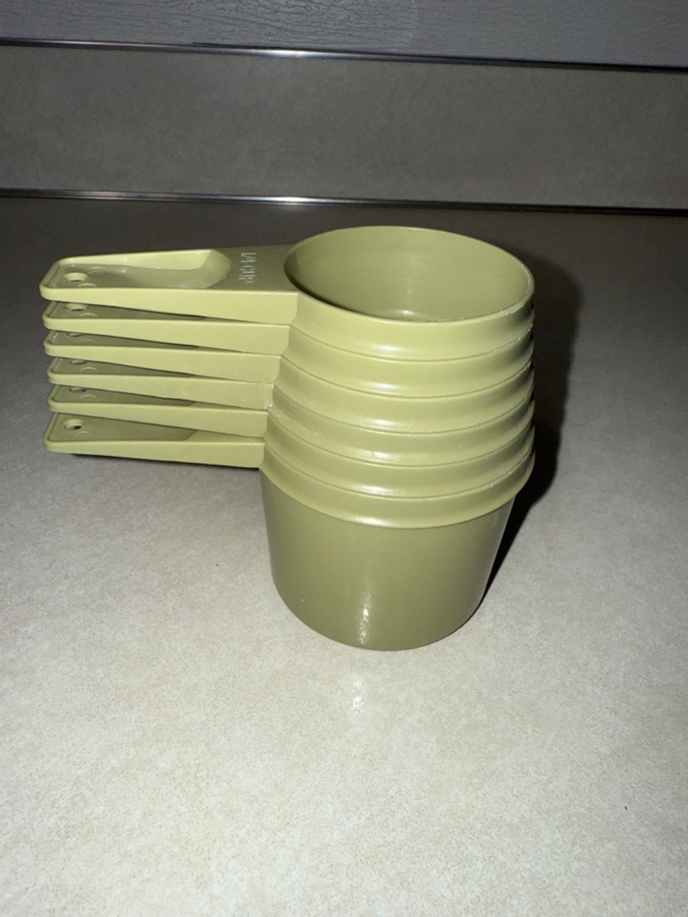 Vintage avocado green Tupperware measuring cups